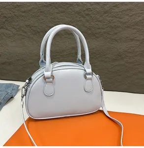 Elegant light blue mini handbag for women, chic bowling bag with crossbody strap