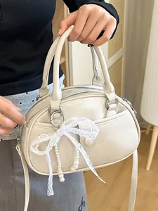 Elegant cream PU leather handbag for women featuring lace bow and pearl charm details