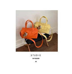 High-capacity women's pillow tote bag in orange and yellow with horse charms
