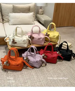 Collection of colorful pillow bags with wide straps and cute horse charms in a cozy room