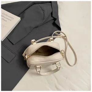 Off-white petite handbag for daily commute with top handle and spacious interior