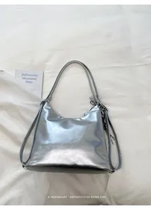 Large silver metallic multi-functional tote bag with a minimalist retro design on white fabric.