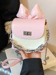 Elegant pink bow-knot mini crossbody bag with woven texture and silver chain strap