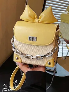 Yellow fashion mini crossbody bag featuring a large bow decoration and chain strap