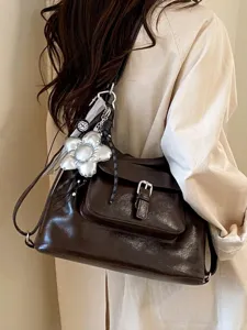 Large capacity dark brown leather crossbody bag with silver flower charm for women