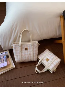 Macro detail view of fashionable 2026 checkered small handbag for stylish women
