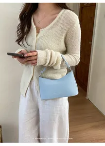 Stylish light blue minimalist underarm shoulder bag for women fashion commuter style trend