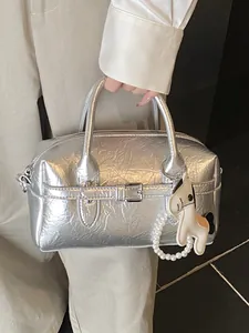 Elegant chic silver metallic Boston handbag with stylish horse charm and pearl detail