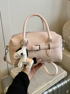 Elegant light pink faux leather Boston bag with a charming white horse pendant decoration.