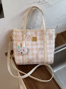 Stylish checkered small tote bag for women with cute rabbit charm and crossbody strap
