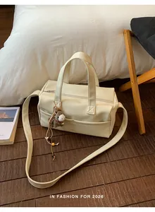 Stylish cream large capacity pillow tote bag with wide strap and plush horse charm