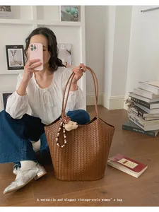 Elegant vintage-style brown woven tote bag detail showing large capacity design