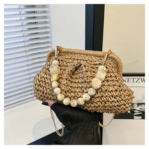 Vintage woven straw clutch with elegant marble bead handle and gold chain strap detail