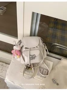 Sweet off-white girl's backpack with silver bow and cute bunny charm accessory
