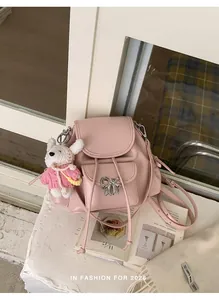 Sweet pink backpack with silver bow detail and a cute plush rabbit charm