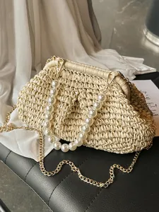 Elegant French retro cream straw woven clutch bag with pearl handle and gold chain