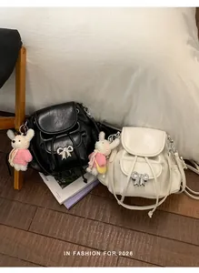 Chic black and white mini backpacks with bow charms and cute plush rabbit pendants