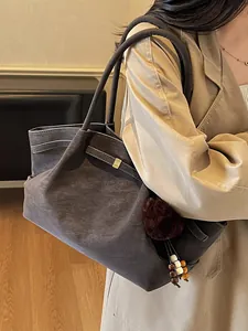 Vintage pleated suede-like large capacity tote bag featuring a decorative pom-pom charm