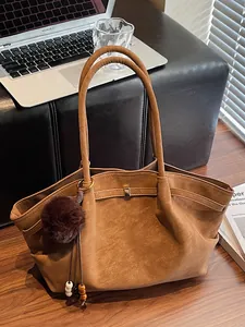 Vintage pleated brown suede tote bag with fur ball pendant for large capacity commuting