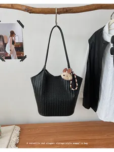 Vintage black woven large capacity tote bag for women featuring a cute bear charm
