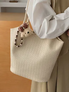Woven vintage-style large capacity cream tote bag with bear charm for daily commute