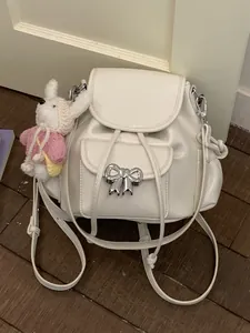 Sweet creamy white faux leather backpack with silver bow clasp and rabbit charm
