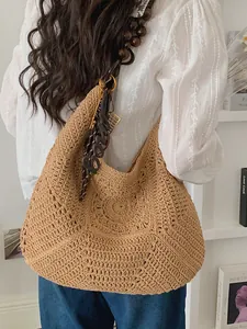 Bohemian hand-woven straw tote bag with beaded shoulder strap for beach vacation