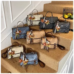 Vintage-style messenger bags in multiple colors with cute teddy bear charm accessories