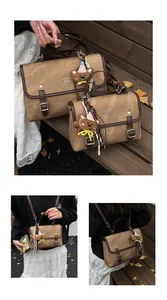 Detail view of vintage brown textured women backpack and handbag with bear charm