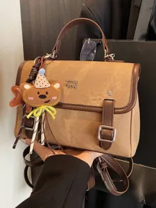Stylish vintage brown textured backpack with cute bear charm for women fashion commute