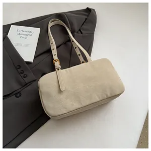 Vintage cream faux leather underarm bag for women styled with an elegant blazer