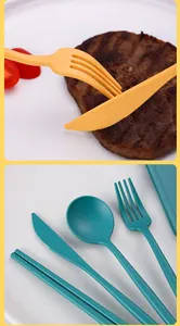 Close-up of wheat straw cutlery set showing fork, knife, spoon and chopsticks in detail