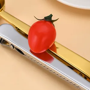 Cuchara medidora 2 en 1 de acero inoxidable oro y plata con un clip para bolsas