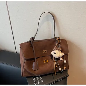 Premium vintage brown suede tote bag featuring soft texture and a cute teddy charm