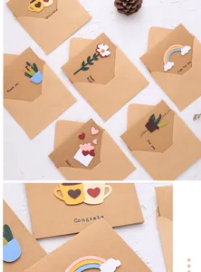Detailed view of 3D greeting cards on kraft paper with various handmade holiday motifs