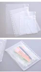 Detailed view of various sizes of transparent punched zipper binder pockets for storage
