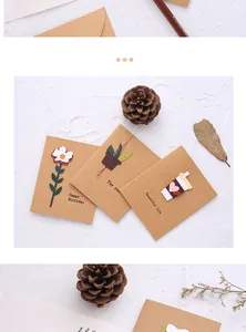 Close-up detail view of 3D kraft paper greeting cards with floral and plant motifs