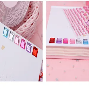 Macro view of colorful 3D crystal gemstone stickers for kids' DIY reward and decoration.