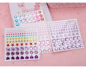 Macro view of colorful 3D gem stickers in heart, star, and round shapes.
