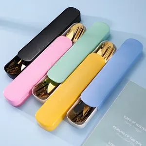 Portable golden stainless steel cutlery set with colorful plastic travel storage cases