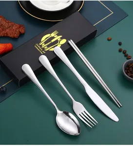 Close-up view of polished stainless steel cutlery set with premium black gift box.