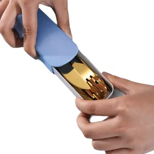 Portable gold stainless steel cutlery set in a blue case being opened
