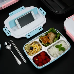 304 stainless steel bento box with compartments and lid used as a mobile phone holder