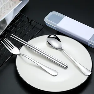 Premium portable 304 stainless steel cutlery set featuring spoon fork and chopsticks on plate