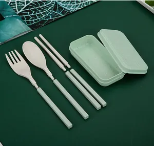 Close-up detail of a portable wheat straw cutlery set featuring detachable handles.