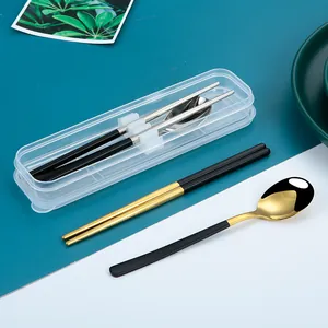 Portable 304 stainless steel cutlery set with black and gold chopsticks and spoon in a case