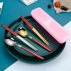Portable 304 stainless steel cutlery set with red handles, gold and silver spoons and chopsticks