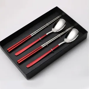 Elegant 304 stainless steel Korean cutlery gift set with red handles and black box.