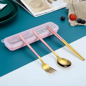 Portable pink and gold 304 stainless steel travel cutlery set with a storage box.