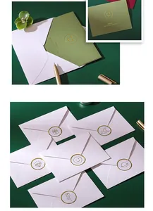 Close-up detail of premium gold foil stamped icons on elegant white greeting envelopes